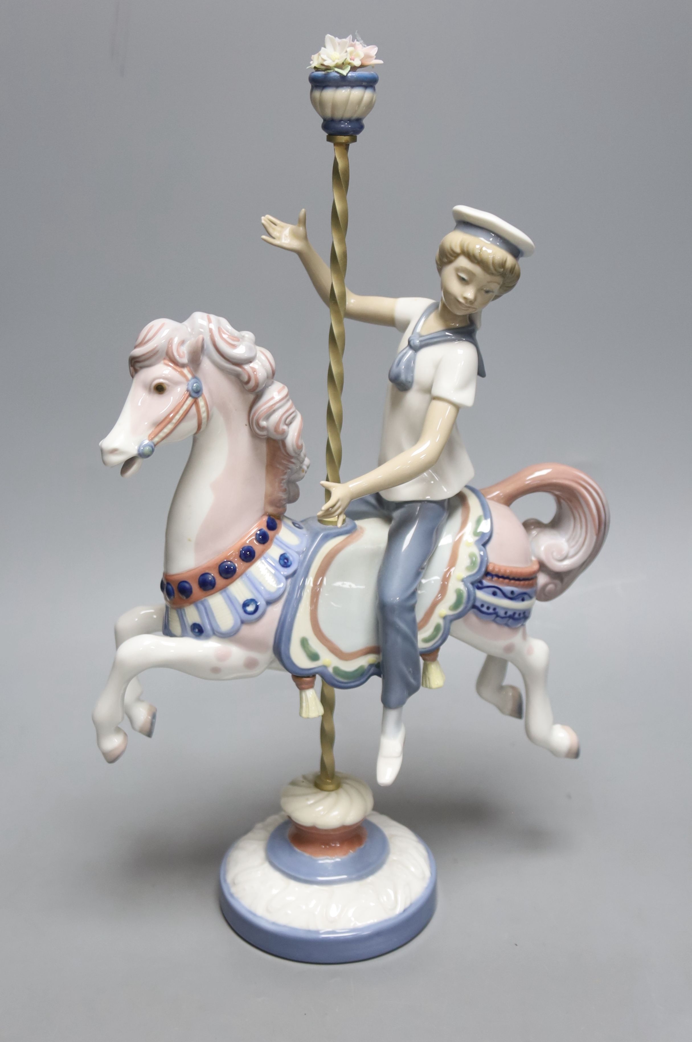 A Lladro figure, Boy on a Carousel Horse, height 39cm H 39cm